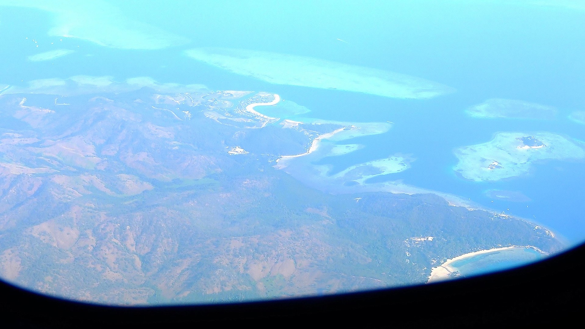 View from aircraft window over Pacific Ocean, Vanuatu.